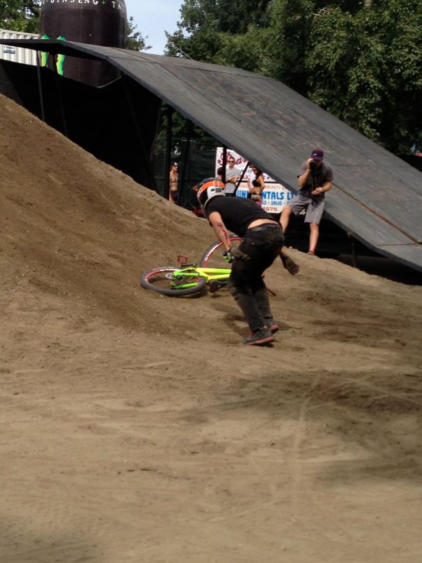 Yes, that is blood — not dirt or ketchup — covering this biker's forearm. Not to worry, he shook it off and was at the top of the drop zone again for his next run. The pain threshold of the biker's was almost as incredible as the tricks they were pulling off, but like they say "practice makes perfect."
