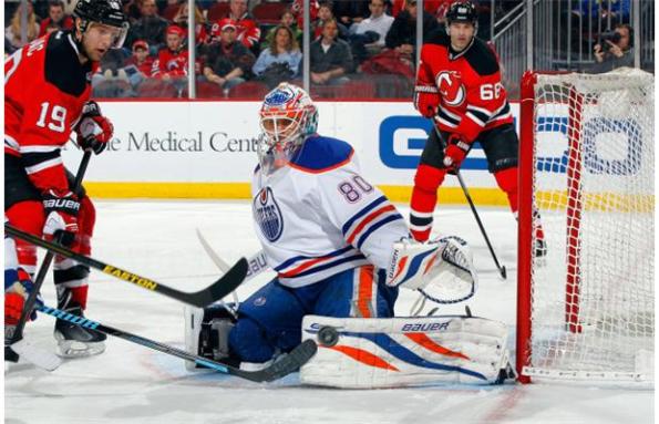 Jim McIsaac/Getty Images Edmonton Oilers goaltender Ilya Bryzgalov makes one of his 22 saves against the New Jersey Devils during NHL action in Newark, N.J., on Friday night. The Oilers were outshot for the seventh straight game (24-20), but salvaged another point in a 2-1 overtime loss that could have went either way.