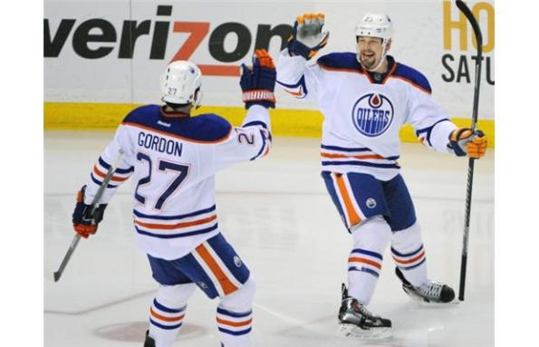 The Associated PressEdmonton Oilers forward Matt Hendricks, right, celebrates his go-ahead goal with linemate Boyd Gordon during third-period NHL action against the Buffalo Sabres on Monday in Buffalo. Hendricks' goal, on a shorthanded breakaway, stood up as the winner in Edmonton's 3-2 victory. The Oilers seem to be making strides, winning four of their last five games.