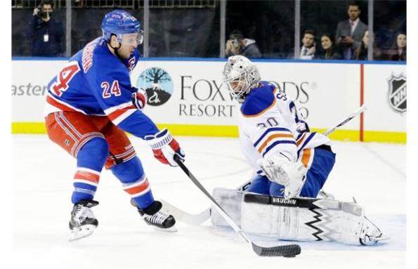 Frank Franklin II/The Associated Press Edmonton Oilers goaltender Ben Scrivens wasn't fooled by New York Rangers captain Ryan Callahan's deke attempt on a shorthanded breakaway during the second period of Thursday's victory. This save, one of 35 for Scrivens on the night, kept the contest tied at 1-1.