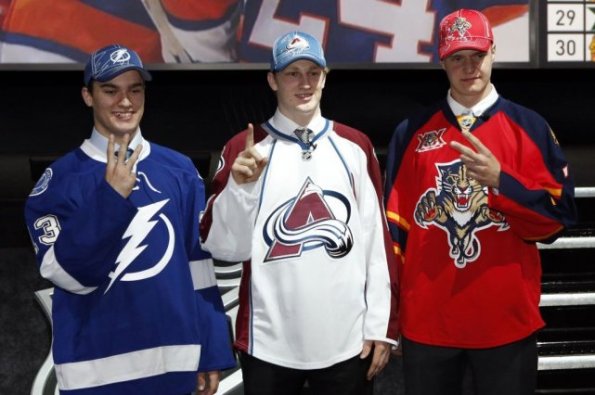 Dave Sandford/Getty Images The top three picks from the 2013 NHL Entry Draft, from left, Jonathan Drouin of the Tampa Bay Lightning, Nathan MacKinnon of the Colorado Avalanche and Aleksander Barkov of the Florida Panthers, pose together shortly after being selected at the Prudential Center in Newark, New Jersey, last June. MacKinnon has since enjoyed a stellar debut season and is the favourite to win the Calder Trophy at this month's awards banquet after setting several rookie records. Barkov also made the immediate jump to the NHL and was turning heads before getting hurt, while Drouin dominated the junior ranks again and is expected to challenge for the Calder in 2014-15. Notably absent from this photo is Seth Jones, who was taken fourth overall by the Nashville Predators and also played in the NHL this season, logging significant minutes and even partnering with Shea Weber towards the end of the campaign. Prior to the 2013 draft, most pundits were predicting Jones and MacKinnon to go 1st and 2nd overall with the order a topic of debate until the Avs announced ahead of time that they would be taking MacKinnon, but Jones surprisingly slipped to No. 4. There's even more uncertainty surrounding the 2014 edition of the NHL draft on June 27 in Philadelphia.